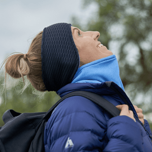 Women looking up into the sky wearing recycled Polartec fleecy lined ear warmers