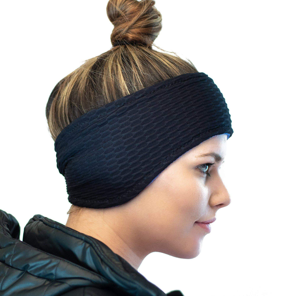 Side view of women wearing recycled Polartec fleecy blue lined ear warmers
