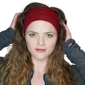 Women wearing red bamboo exercise headband looking into the camera