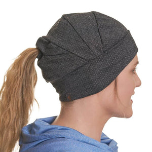 Side view of women wearing black mernio wool beanie showcasing the detail in the stitching