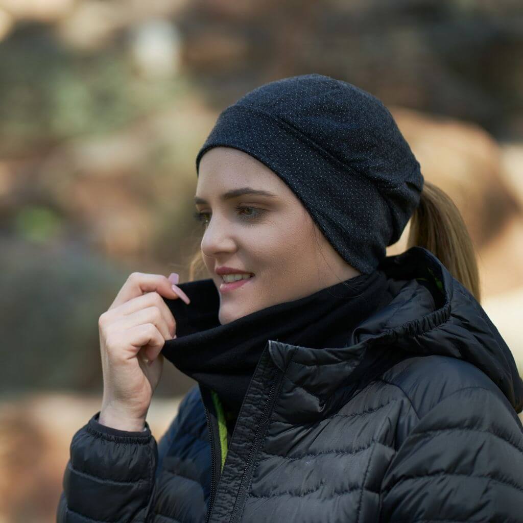 Women wearing black merino wool ponytail friendly beanie