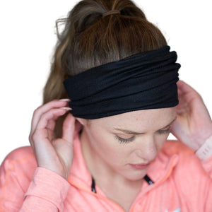 Women wearing black merino wool sports headband