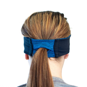 women wearing blue-black reversible winter sports headband