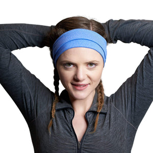 Women wearing blue adjustable tie behind workout headband