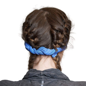 Back view of women wearing blue adjustable tie behind sports headband