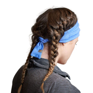 Women wearing blue adjustable tie behind workout headband
