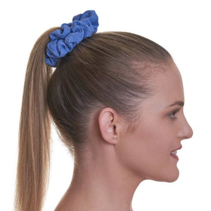Side view of women wearing blue gym scrunchie.