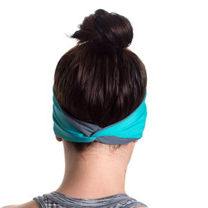 Women wearing a aqua/gray reversible running headband showcasing twist 
