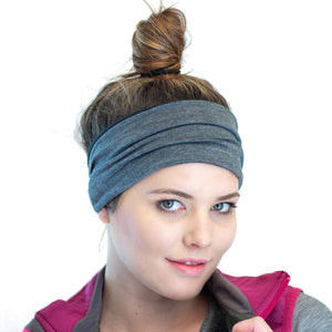 Head shot of women wearing a striped/grey merino wool reversible winter ear warmer