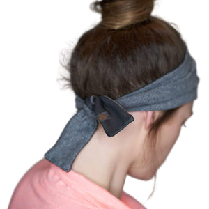 Women wearing gray reversible adjustable tie behind sports sweatband