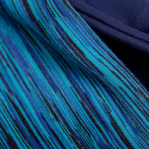 Close up of fabric used to make dark blue-marine-aqua reversible winter sports headband