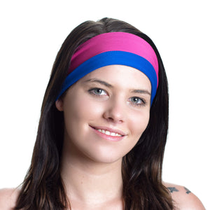 Women wearing a pink/blue reversible exercise headband