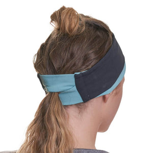 Back view of women wearing reversible ponytail friendly winter headband  with pony tail through the back slot