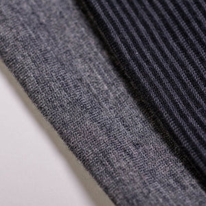 Close up of fabric used to make striped/grey merino wool reversible sports winter headband
